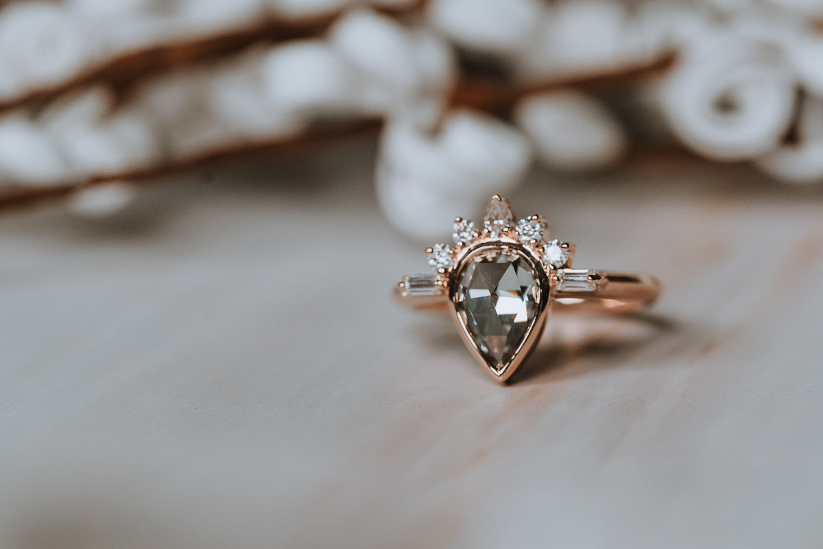 The Amur | Pear Cut Half Sunburst Moissanite Ring