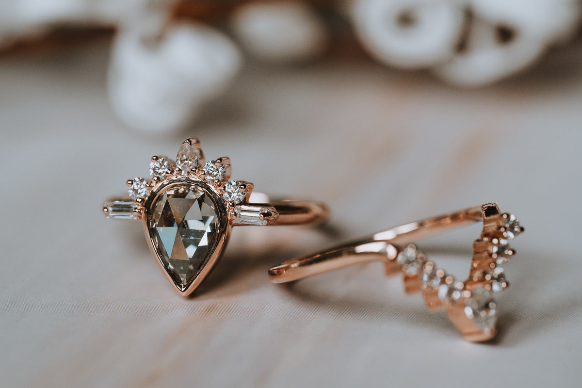 The Amur | Pear Cut Half Sunburst Moissanite Ring