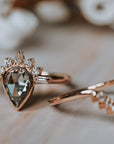 The Amur | Pear Cut Half Sunburst Moissanite Ring